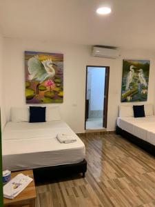Postel nebo postele na pokoji v ubytování Hotel Agroturistico Palma Vino