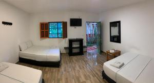 Postel nebo postele na pokoji v ubytování Hotel Agroturistico Palma Vino