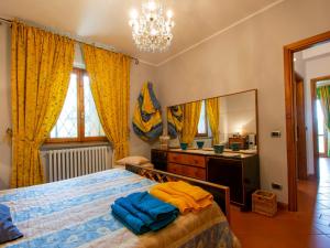 A bed or beds in a room at Holiday Home Allodola by Interhome
