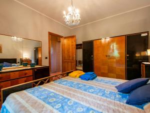 A bed or beds in a room at Holiday Home Allodola by Interhome
