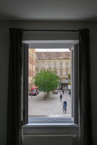 a view of a city street from a window at Euro Square Studios in Zagreb