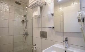 a bathroom with a shower and a sink and a mirror at Queen Victoria Suit Apart OTEL in Bodrum City +12 photos
