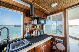 a kitchen with a sink and a counter top at Beautiful Houseboat in Key West in Key West