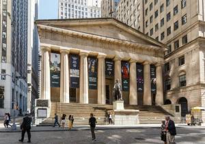 a large building with a statue in front of it at Modern Two Bedroom At UES in New York