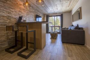 TV a/nebo společenská místnost v ubytování Résidence Le Domaine du Jardin Alpin - Courchevel 1850