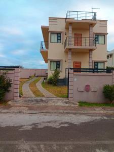 a large house with a driveway in front of it at Fleur d'Epine in Trou d'Eau Douce