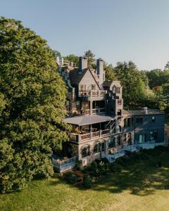 an aerial view of a large house with a tree at The Norumbega Inn in Camden