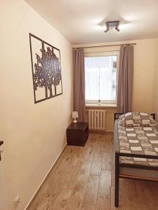 Posteľ alebo postele v izbe v ubytovaní APARTAMENT CENTRUM Międzychód
