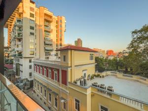 a view of a building in a city with buildings at Downtown Grand Comfort in Tirana