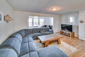 a living room with a couch and a tv at Murrells Inlet Vacation Rental about 4 Mi to the Beach in Myrtle Beach