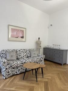 a living room with a couch and a table at Kaštieľ Ladce 