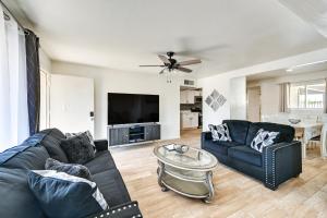 a living room with a couch and a table at Sunny Yuma Vacation Rental with Private Pool! in Yuma