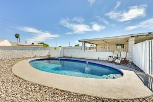 a swimming pool in the backyard of a house at Sunny Yuma Vacation Rental with Private Pool! in Yuma