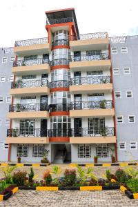 an apartment building with balconies and plants in front of it at Meru Heights in Meru