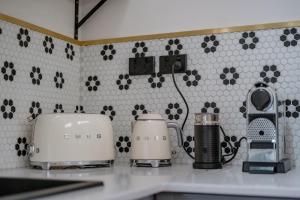 a kitchen counter with two toasters on a counter top at The River Stables 