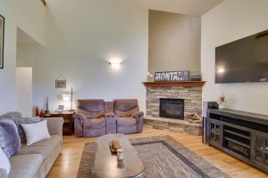 a living room with two couches and a fireplace at 9 Mi to Downtown Bozeman Vacation Home with Hot Tub in Bozeman