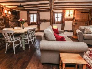 a living room with a couch and a table at 18 Church Street in Llangollen