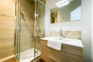 a bathroom with a sink and a shower at #GA At the heart of the essential 1 - New studio in Saint-Martin-le-Vinoux