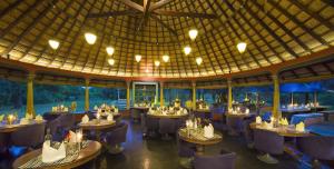 an image of a restaurant with tables and chairs at The Dune Eco Village and Spa - Pondicherry in Puducherry