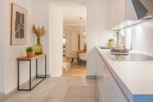a kitchen with white walls and a counter at B49 - City & Messe Apartment in Cologne