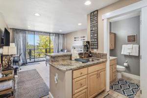 a large bathroom with a sink and a toilet at Truckee Studio with Balcony and On-Site Skiing! in Truckee