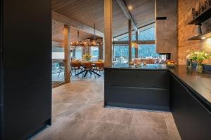 an open kitchen and dining room in a house at Chalet Amarou - OVO Network in Châtel