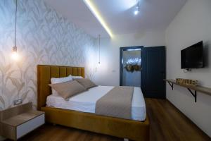 Ένα ή περισσότερα κρεβάτια σε δωμάτιο στο Melnaz Apartament 3