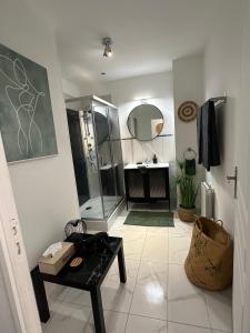 a bathroom with a shower and a sink at Le brise lame maison neuve à 2 pas de la plage in Le Portel +40 photos