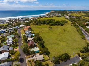 an aerial view of a suburb with the ocean at Blue House Surf Shack - Pet Friendly in Lennox Head