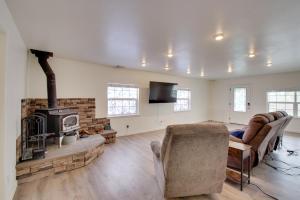 a living room with a couch and a fireplace at Crescent City Home with Hot Tub Half-Block to Beach in Crescent City