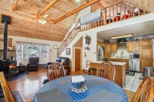 a dining room and kitchen with a table and chairs at Peaceful Pinetop-Lakeside Cabin with 4 Decks! in Pinetop-Lakeside
