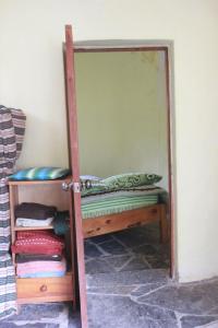 a bedroom with a bunk bed with a mirror at Albergue Esmeralda - Camping in Sorata