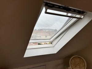 a skylight in a ceiling with a window at Wembley Stadium Luxury 6 bed sleeps 14 in London