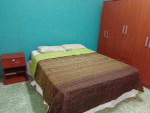 En eller flere senge i et værelse på Mi Viejo