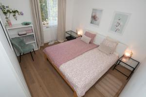 a bedroom with a bed and a table and chairs at Luxury Apartment Res in Ljubljana