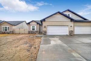 a house with a garage and a driveway at Travelers Hideout #2 in Twin Falls