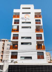 a tall white building with the words asbestos on it at D.O.M.A. Residencial Alegria in Torrevieja