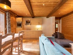 a kitchen and living room with a table and chairs at Cosy apartment in Tignes with garden in Tignes