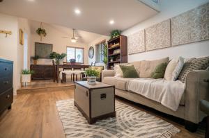 a living room with a couch and a table at Beach Shack in Huntington Beach