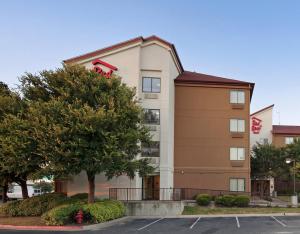 a rendering of the front of a hotel at Red Roof Inn PLUS+ Austin South in Austin