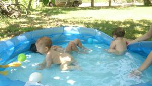 a group of three babies playing in a pool at Sera Pansiyon in Cıralı