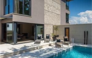 a house with a swimming pool next to a house at Villa Oliva 1 in Umag +52 photos