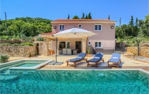 a villa with a swimming pool and a house at Villa Punte Bianche in Zadar