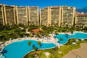 an aerial view of a resort with a large pool at Beach Front-Ocean Views-Marina Luxury Condo-BVG in Puerto Vallarta