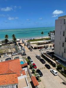 an aerial view of a parking lot next to the beach at Apartamento em Camboinha PB in Cabedelo