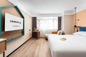 Letto o letti in una camera di Guangzhou Yilin Hotel - Xiaogang metro Store