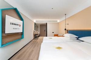 Letto o letti in una camera di Guangzhou Yilin Hotel - Xiaogang metro Store