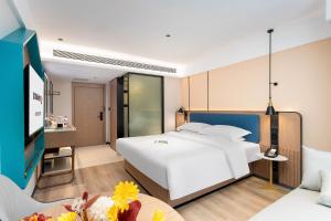 Letto o letti in una camera di Guangzhou Yilin Hotel - Xiaogang metro Store
