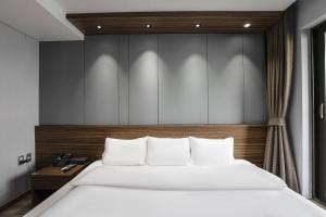 Postel nebo postele na pokoji v ubytování Western Grace Hotel Incheon