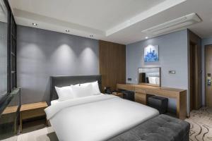 Postel nebo postele na pokoji v ubytování Western Grace Hotel Incheon